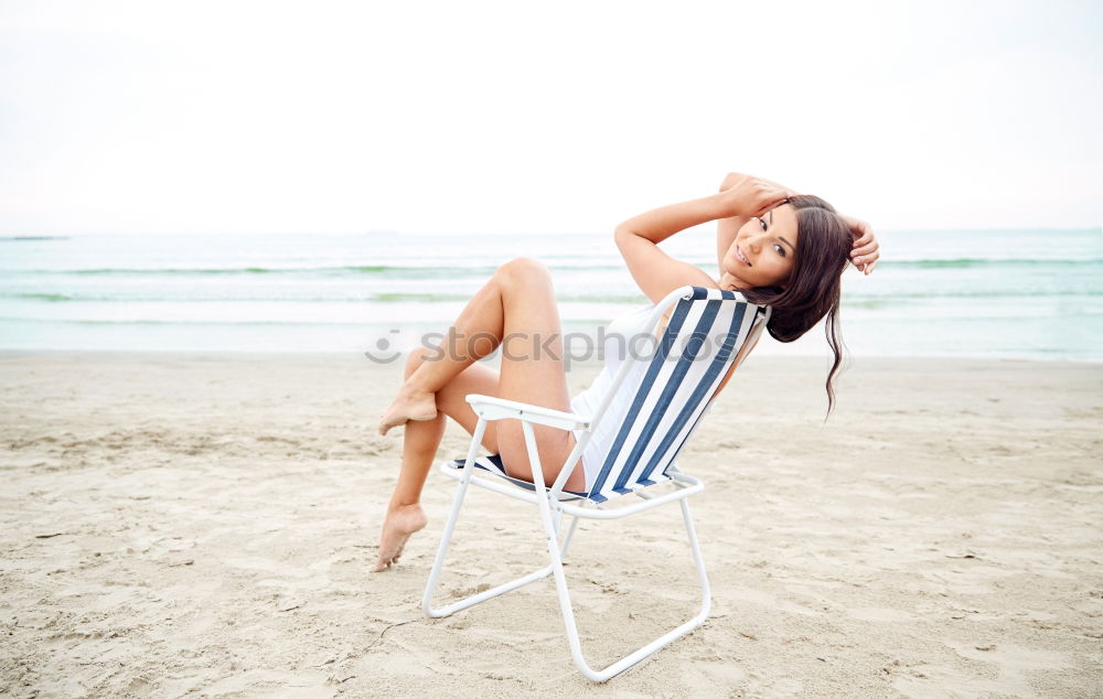 Similar – Woman with afro hairstyle sitting on a bench moving her legs