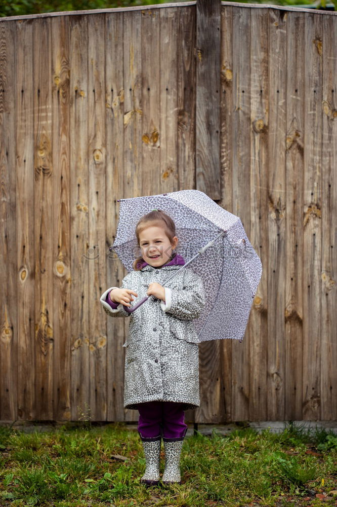 Similar – Rubber boots in the mud