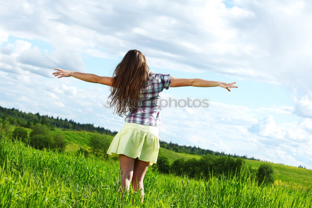 Similar – Image, Stock Photo Back view of a young woman in nature in a sunny autumn day