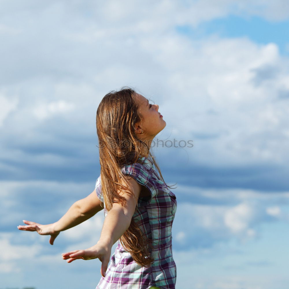 Similar – Image, Stock Photo Excited women lying on cliff