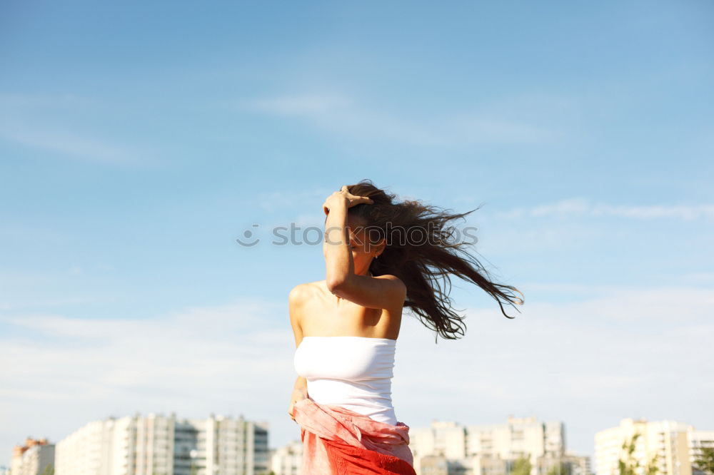 Similar – Blonde white woman moving the hair with the wind.