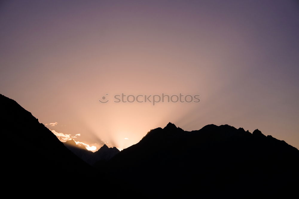 Similar – Mountain silhouette in sunset