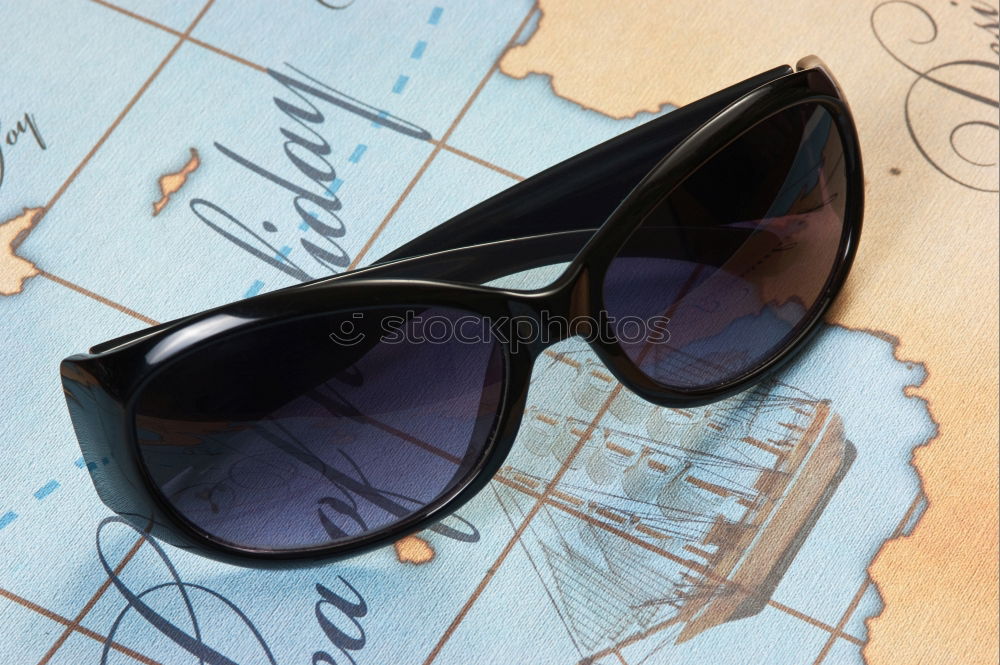 Similar – Image, Stock Photo beige sunglasses on palm leaf, travel concept object