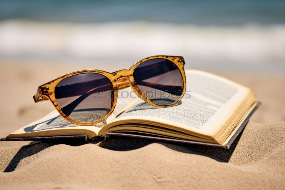 Similar – Reading on the beach Beach