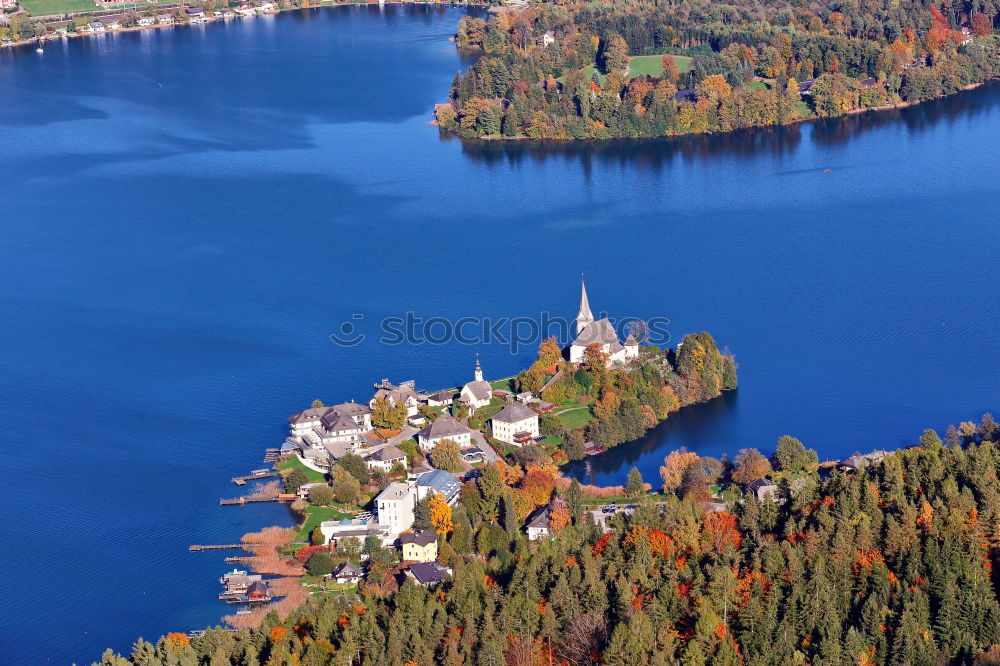 Sunny autumn day on the lake in mountains of south Austria