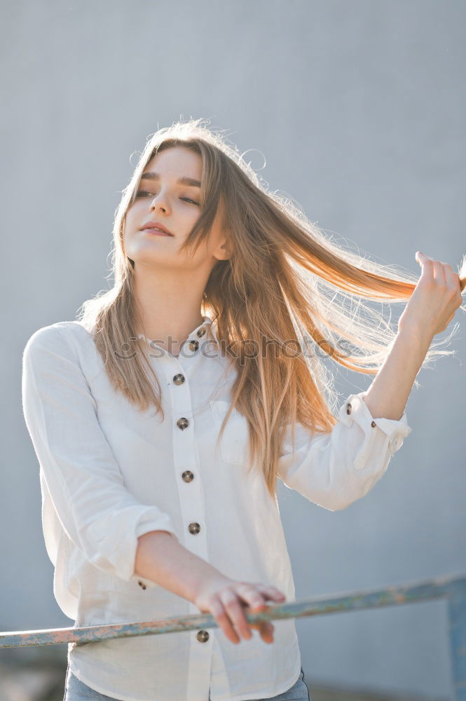 Similar – Foto Bild Frau mit Rock und Bluse greift sich in Haare