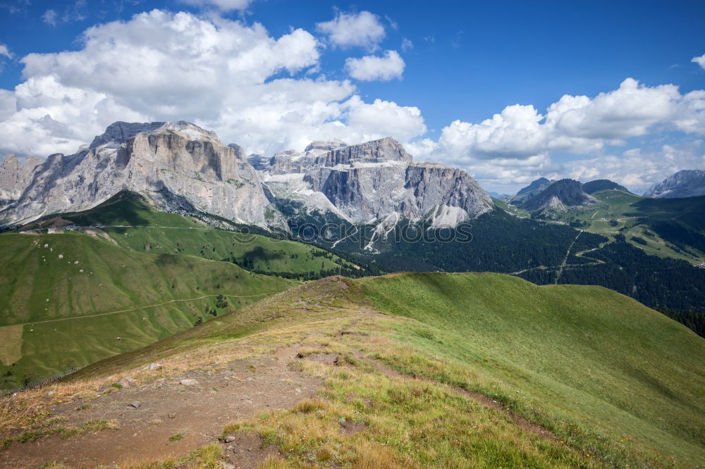 Similar – Hiking trail with hiker with panoramic view in the Dolomites