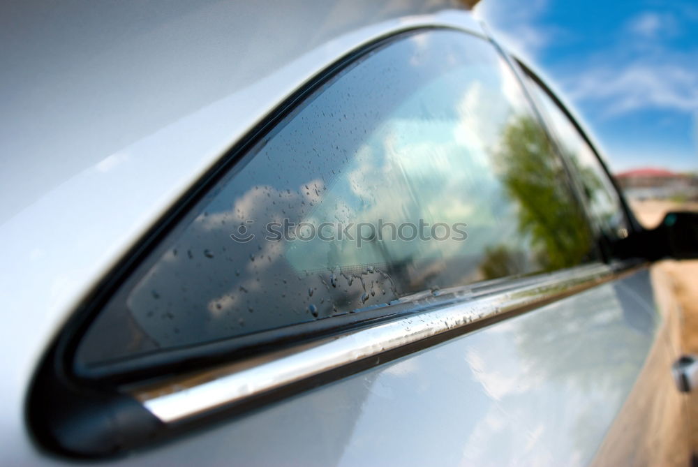 Similar – Image, Stock Photo Sunny car ride. View through the windshield onto the highway. Eyes and glasses of the driver as reflection in the rear view mirror.