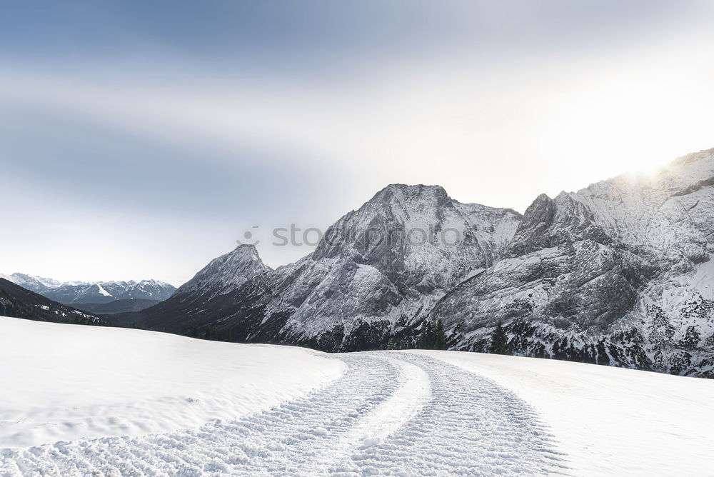 Similar – Image, Stock Photo Winter sunshine over snowy mountains