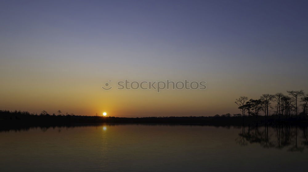 Similar – Warm twilight landscape on a beautifull cloudy sky