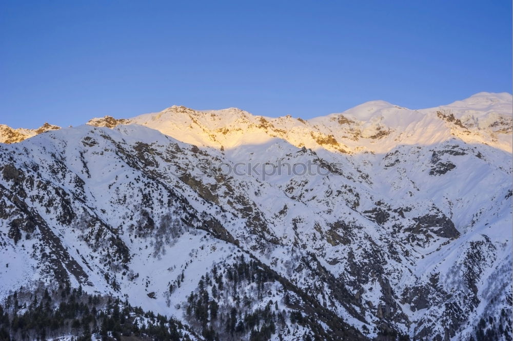 Image, Stock Photo Sunset over the winter mountains