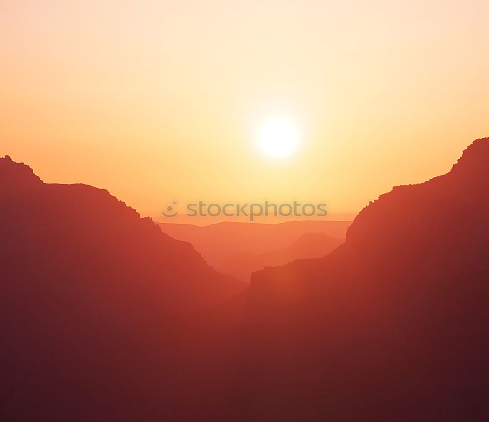 Similar – Cliff climbed, now the man can enjoy the sunset