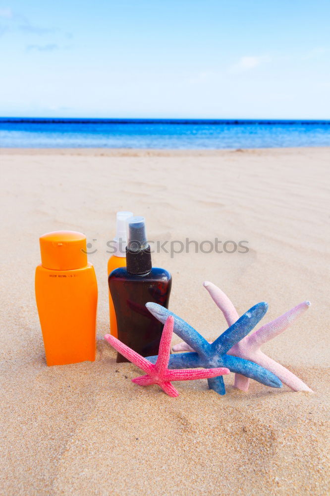 Image, Stock Photo Towel, beach ball, sunscreen and water gun on the beach