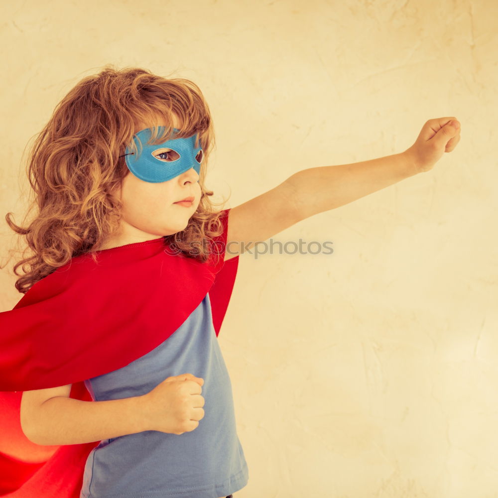 Similar – Happy little child playing superhero. Kid having fun outdoors. Concept of girl power.