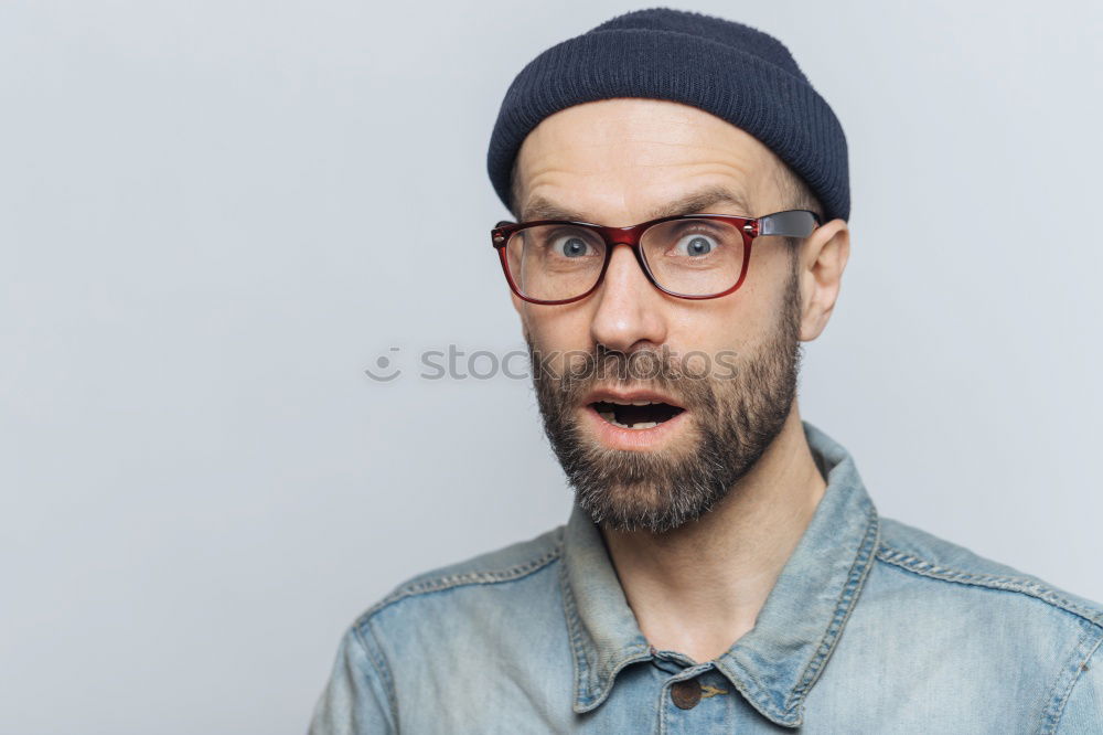 Similar – Portrait of a man with glasses and mustache with crossed arms