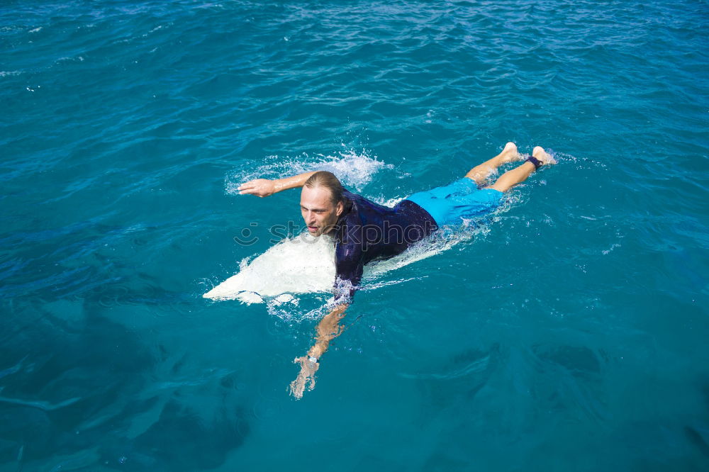 Similar – Image, Stock Photo “Summer” at its best, Fun in the Pacific, Little water bomb in the ocean.