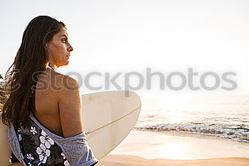 Similar – Image, Stock Photo Two happy girlfriends having fun at the beach with surfboards