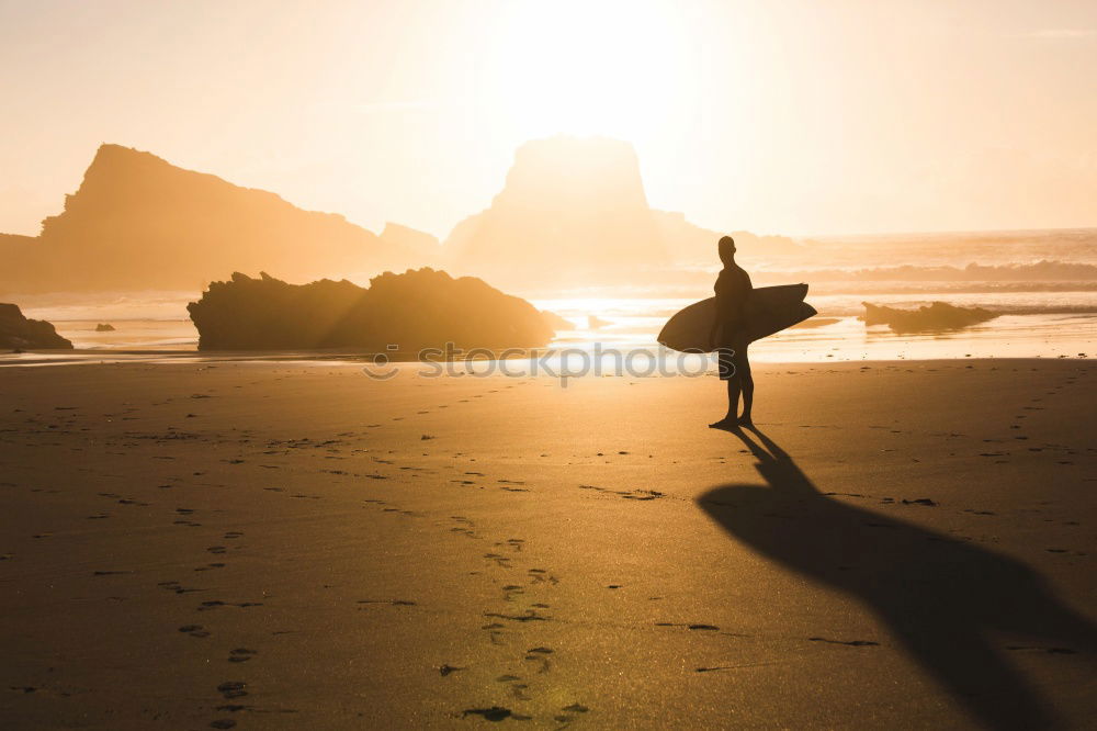 Similar – Man sitting on fence in rocky coast