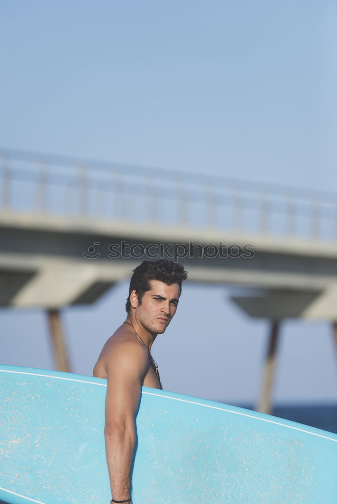 Similar – Young attractive surfer holding his surfboard at the beach