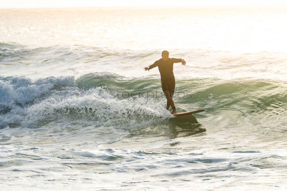 Similar – Image, Stock Photo Man in wetsuit swimming in ocean