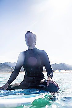 Similar – Image, Stock Photo Man in wetsuit swimming in ocean