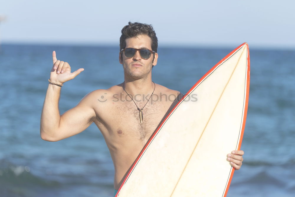 Similar – Young attractive surfer holding his surfboard at the beach