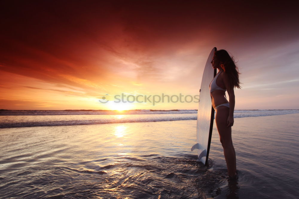 Similar – Happy little girl jumping on the beach at the sunset time