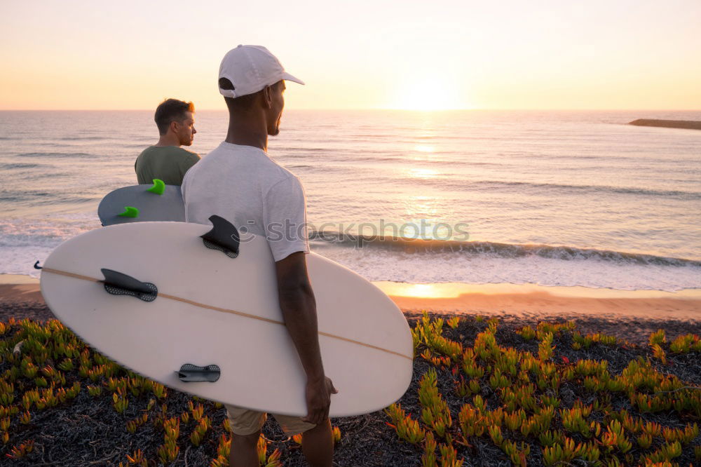 Similar – Image, Stock Photo Two happy girlfriends having fun at the beach with surfboards