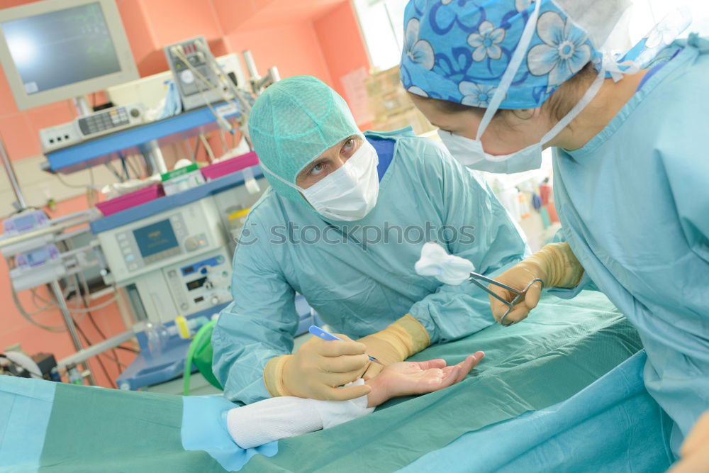 Similar – Team of Surgeons Operating.