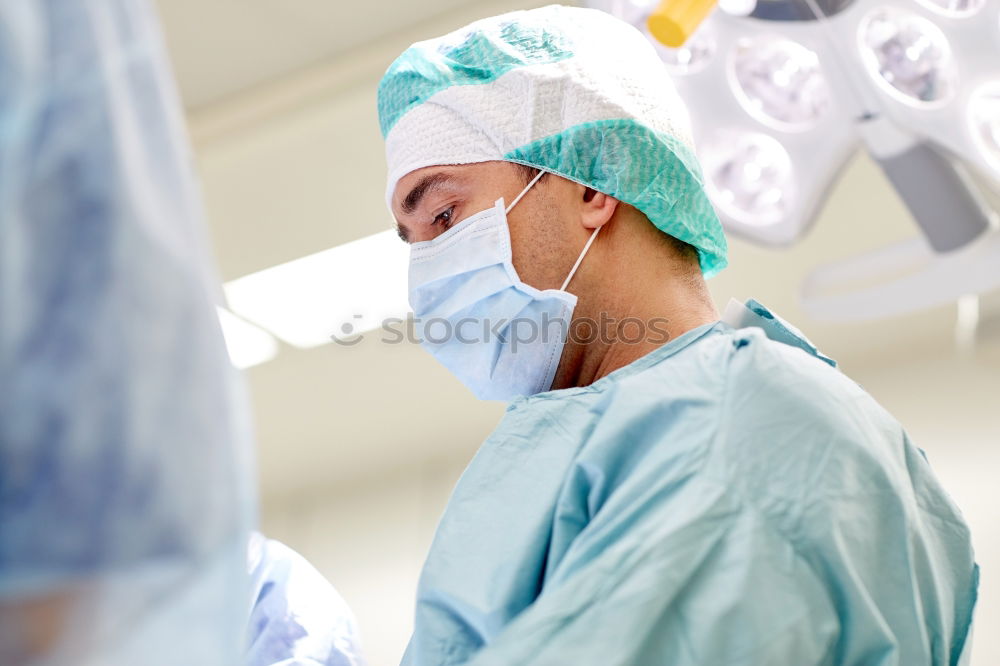 Similar – Image, Stock Photo Team of Surgeons Operating.