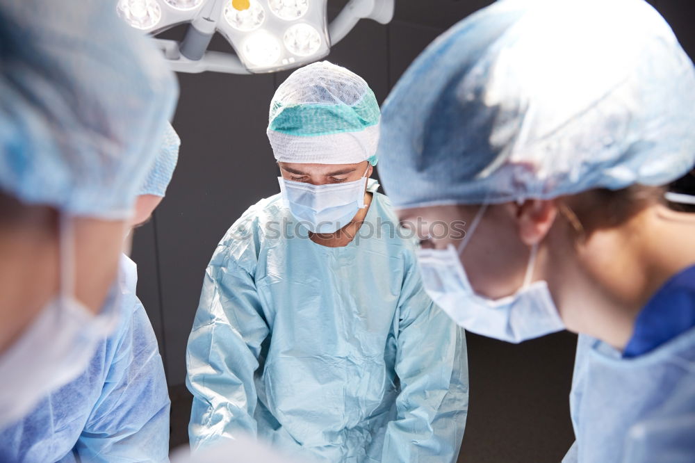 Similar – Team of Surgeons Operating.