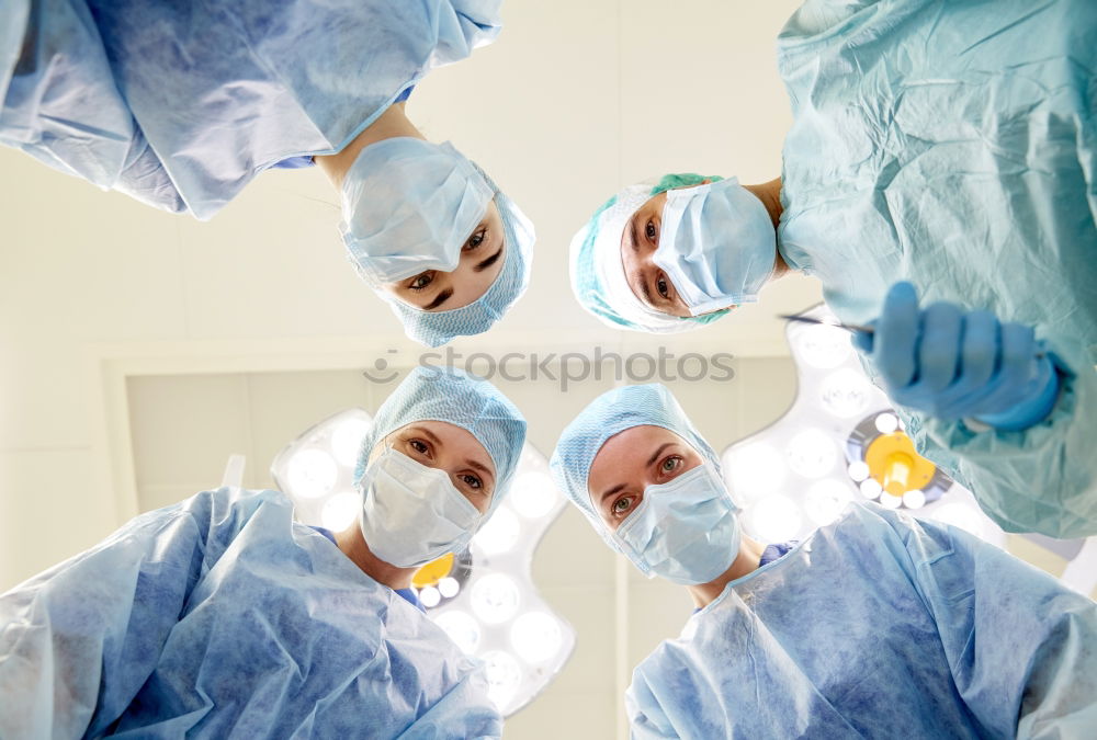 Similar – Image, Stock Photo Team of Surgeons Operating