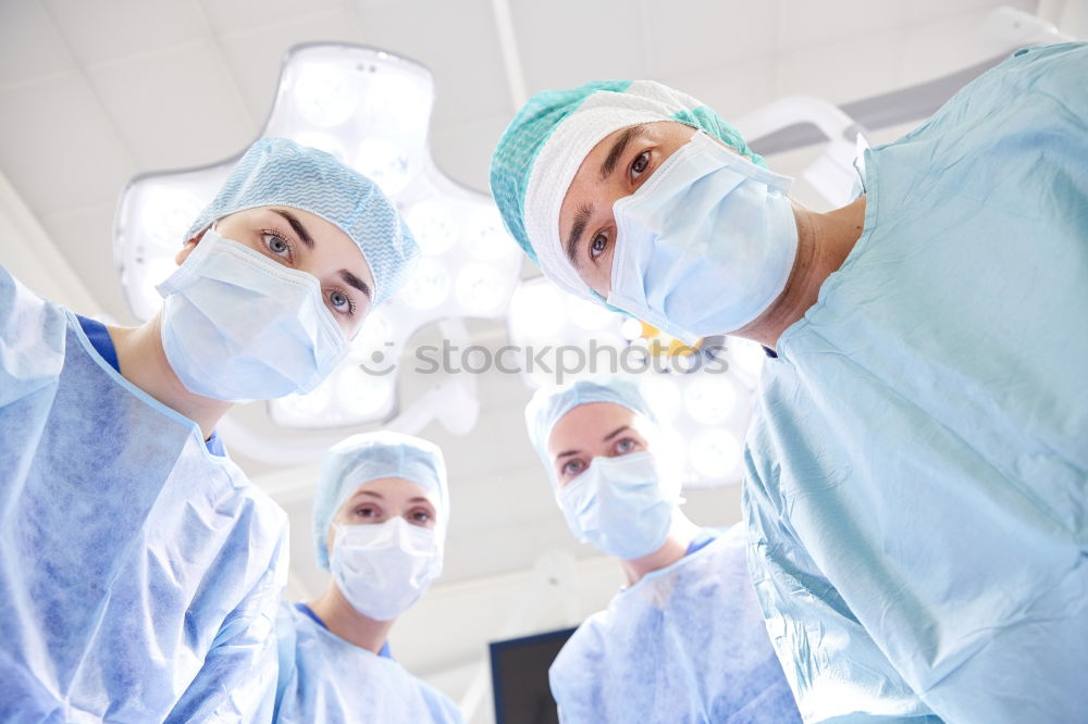 Similar – Image, Stock Photo Team of Surgeons Operating