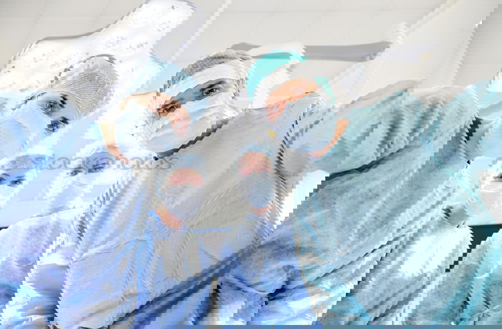 Image, Stock Photo Team of Surgeons Operating.