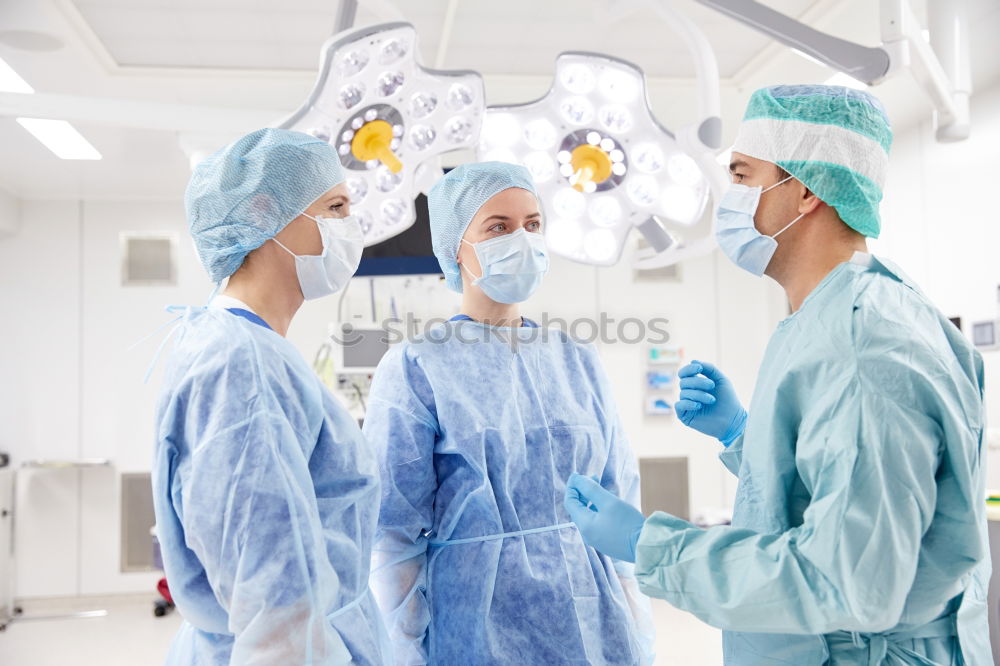 Similar – Image, Stock Photo Team of Surgeons Operating