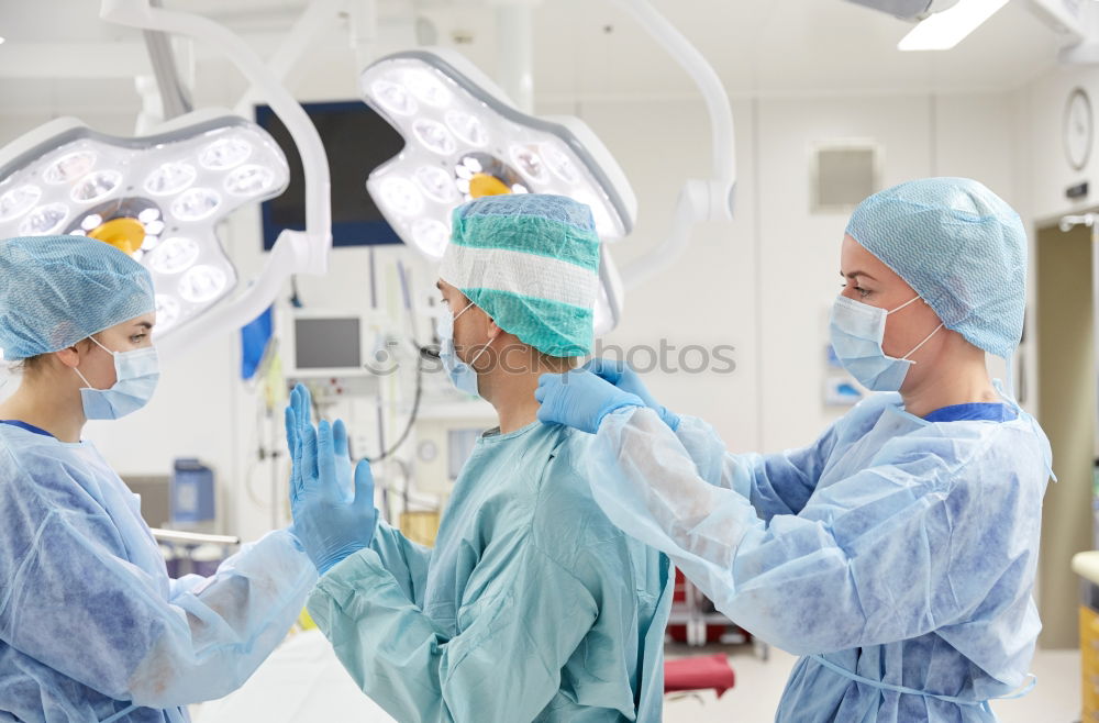 Similar – Image, Stock Photo Team of Surgeons Operating