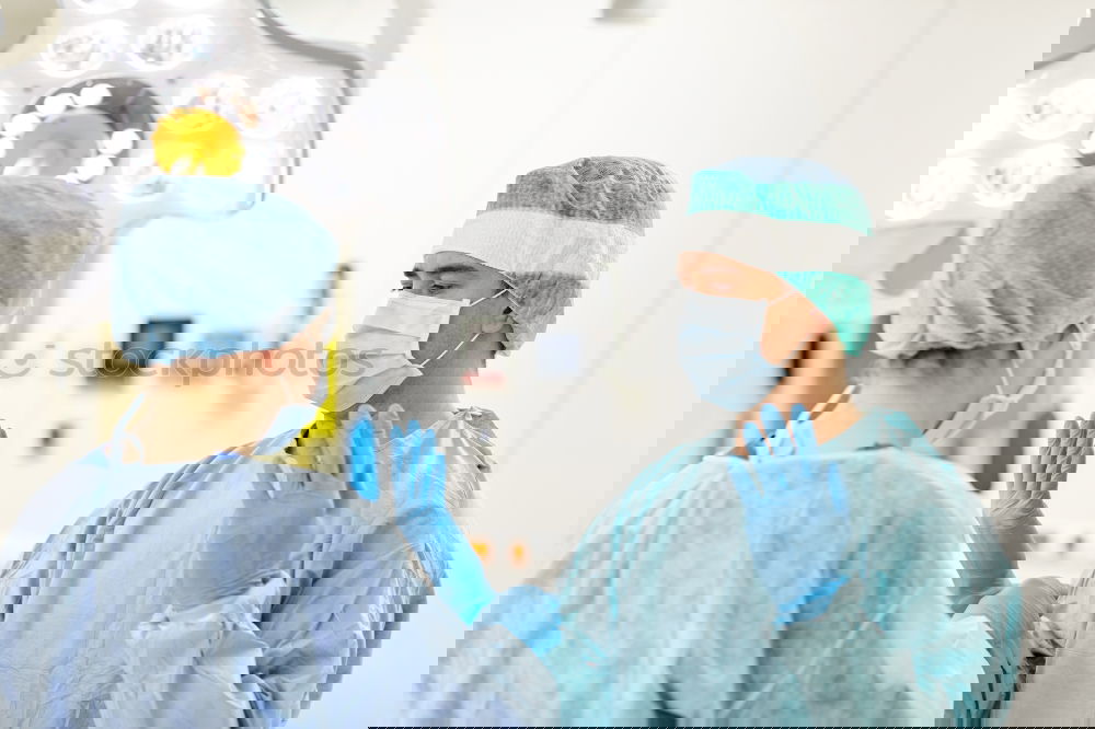 Similar – Image, Stock Photo Team of Surgeons Operating.
