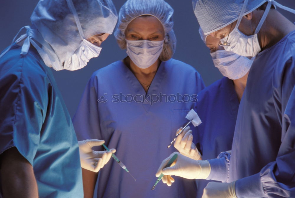 Similar – Image, Stock Photo Team of Surgeons Operating.