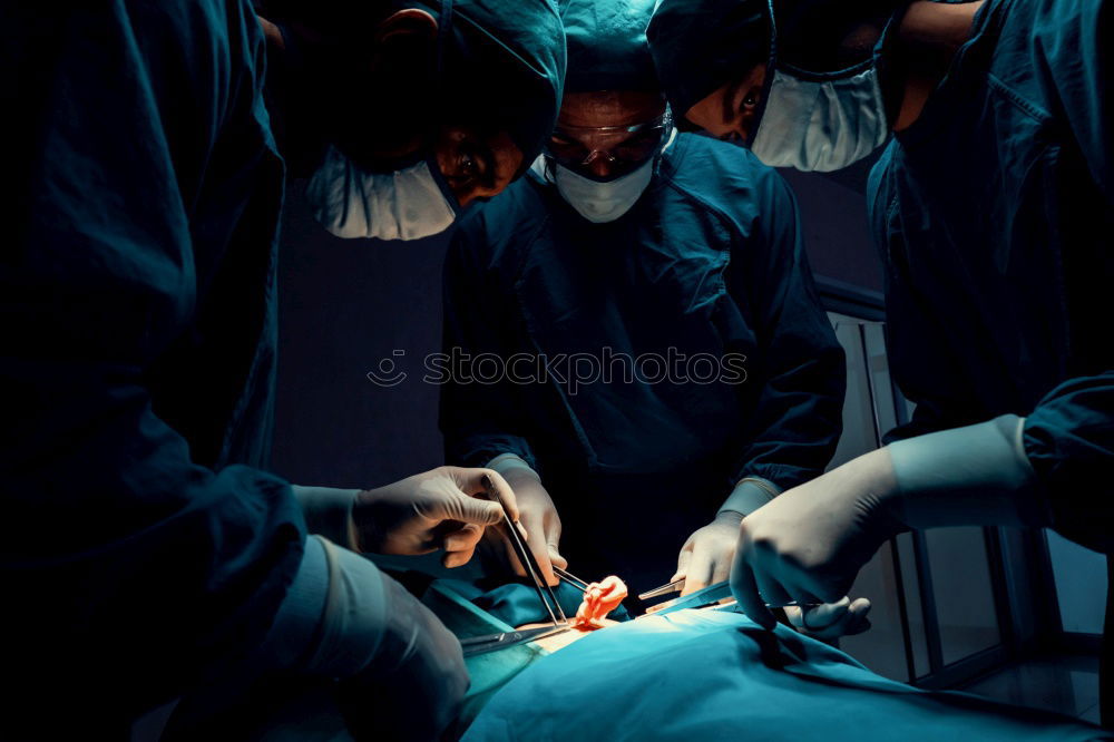 Similar – Image, Stock Photo Team of Surgeons Operating.
