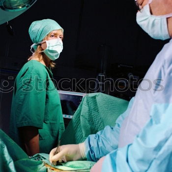 Similar – Image, Stock Photo Team of Surgeons Operating.