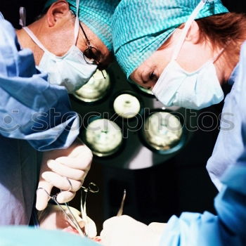 Similar – Image, Stock Photo Team of Surgeons Operating.
