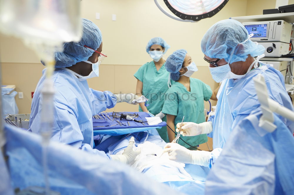 Similar – Team of Surgeons Operating.