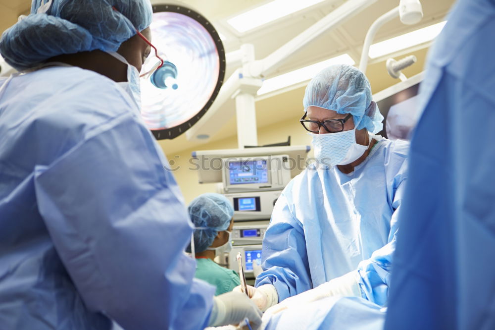 Similar – Image, Stock Photo Team of Surgeons Operating.