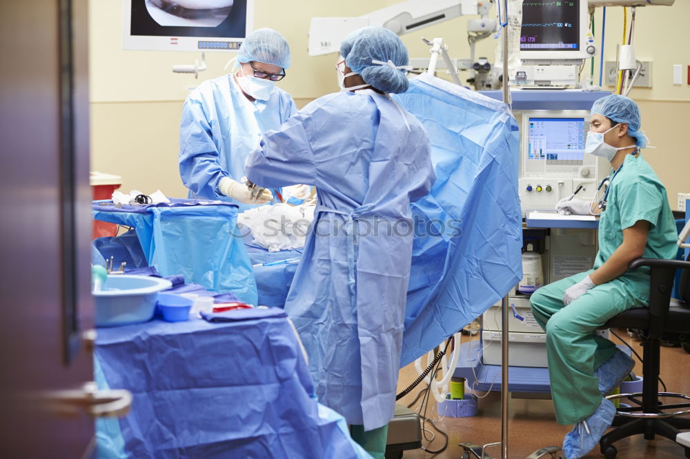 Similar – Image, Stock Photo Team of Surgeons Operating.