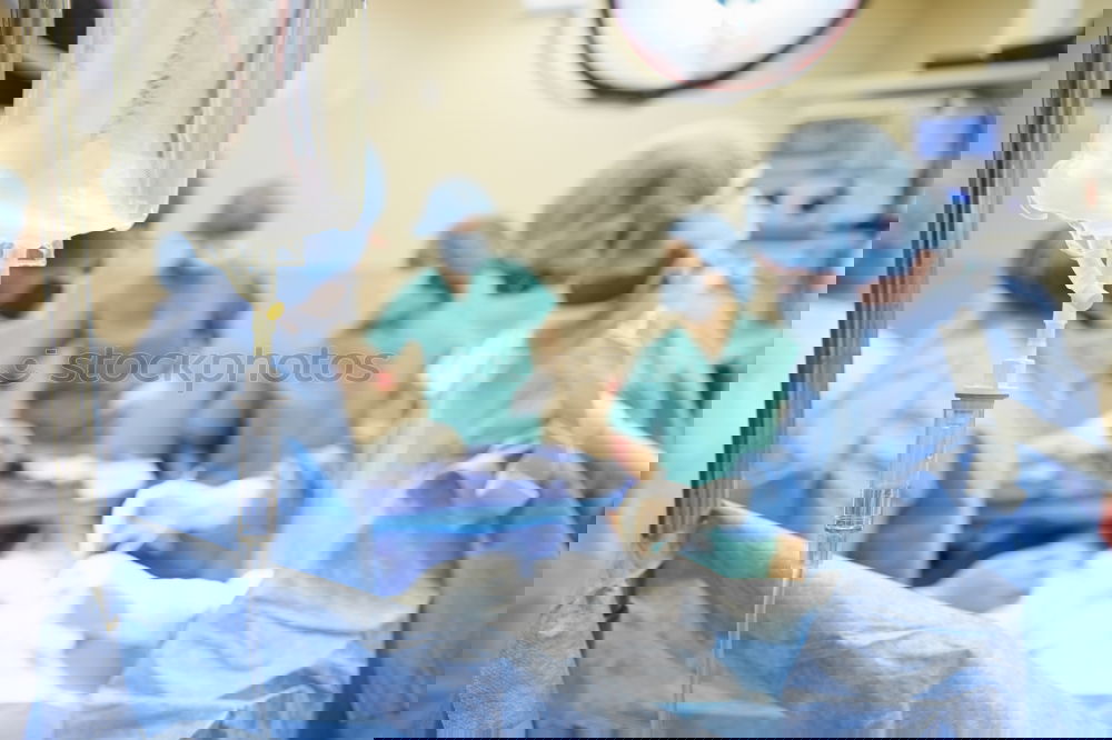Similar – Image, Stock Photo Team of Surgeons Operating.