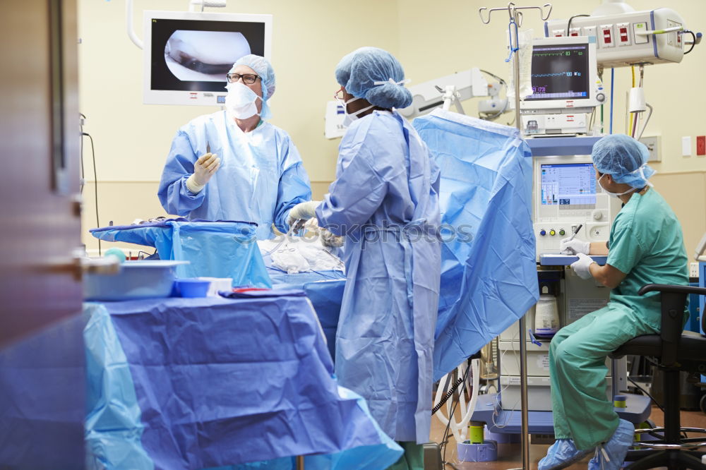 Similar – Image, Stock Photo Team of Surgeons Operating.