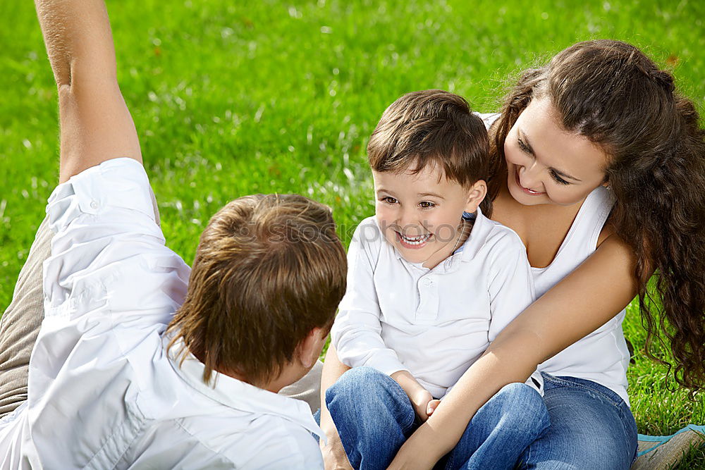 Similar – Happy family in a urban park playing with tablet computer