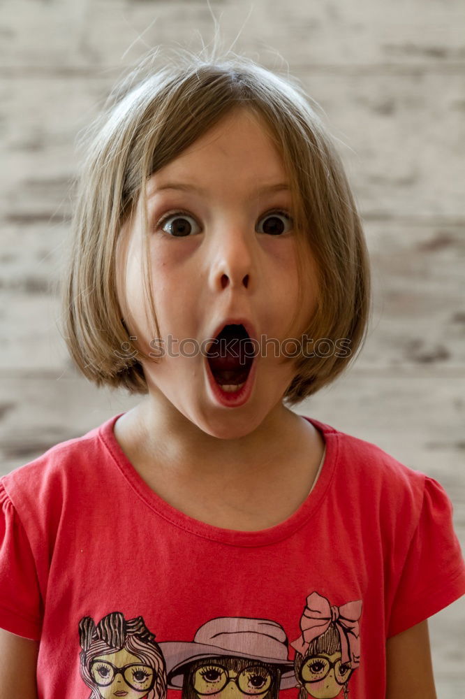 Similar – Young angry woman biting a bouquet of roses