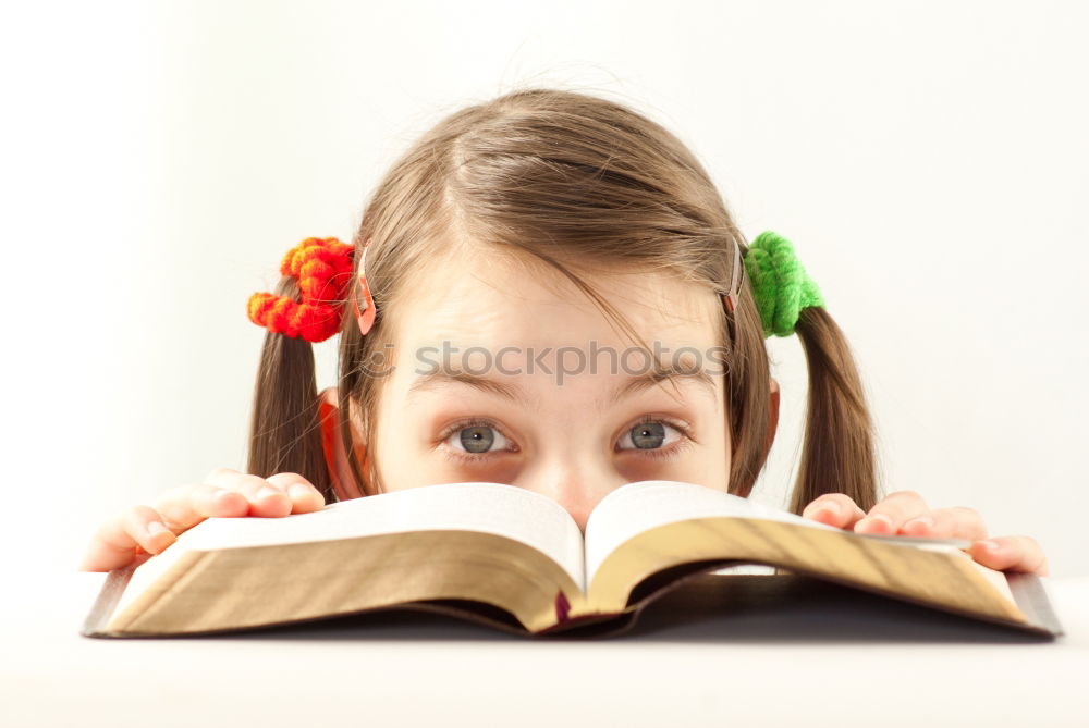 Similar – Image, Stock Photo happy and smiling child with book on head