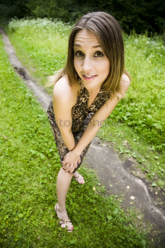 Similar – Summer portrait of long haired teen girl with short jeans shorts and belly top in park